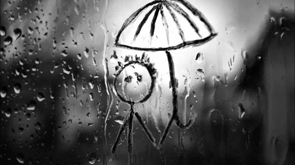 Рисунок человека под дождем на оконном стекле